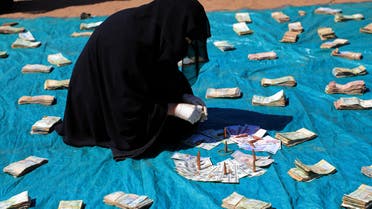 Huthi female supporters collect money to support Huthi militias fighting Saudi-backed Yemeni government forces in the port city of Hodeidah, during a rally in the capital Sanaa on November 10, 2018.