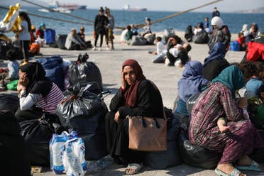 Refugees and migrants wait to be transferred to camps on the mainland, at the port of Elefsina near Athens Greece, October 22, 2019. (Reuters)