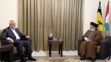 This picture released by the Hezbollah Media Relations Office, shows Hezbollah leader Hassan Nasrallah, right, meeting with Ismail Haniyeh in Beirut, Lebanon, June 29, 2021. (AP)