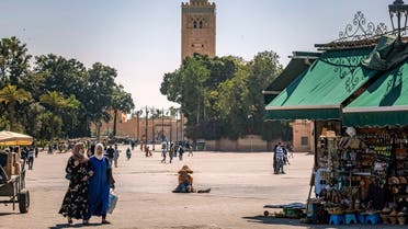 Few people walk in the Jemaa el-Fna square in the Moroccan city of Marrakesh, on May 6, 2021, which has been impacted by the COVID-19 crisis since its start due to the scarcity of tourism. (Fadel Senna/AFP) 
