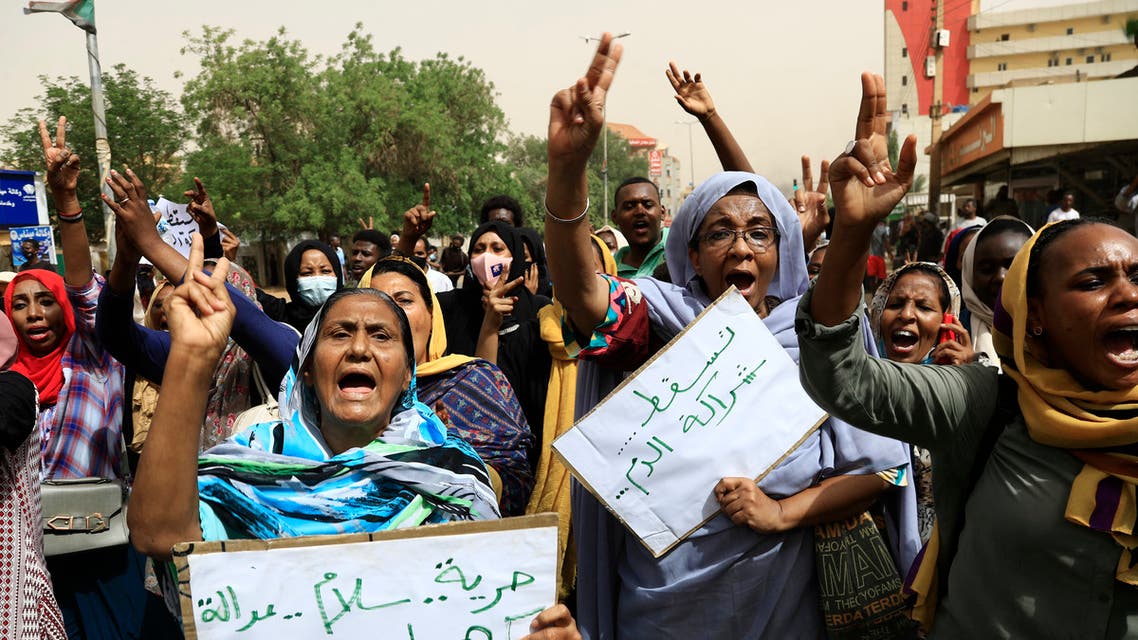 Sudanese protesters take part in a demonstration in the capital Khartoum on June 30, 2021, urging the government to step down over delayed justice and recent harsh economic reforms. (AFP)
