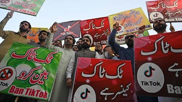 Activists carry banners and placards as they take part in a demonstration demanding the ban of a social media application ‘TikTok’ in Islamabad on June 26, 2021. (Farooq Naeem/AFP)