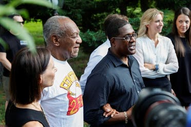 Bill Cosby stands next to his spokesperson Andrew Wyatt, and lawyer Jennifer Bonjean outside his house after Pennsylvania's highest court overturned his sexual assault conviction and ordered him released from prison immediately, in Elkins Park. (Reuters)