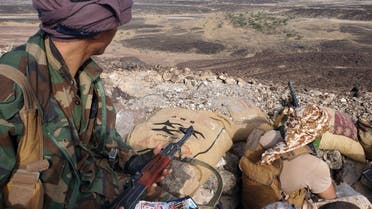 Fighters loyal to Yemen's Saudi-backed government mans a position near the frontline facing Iran-backed Huthi rebels in the country's northeastern province of Marib, on May 13, 2021.