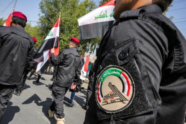 استعراض للحشد الشعبي في بغداد في يونيو الماضي