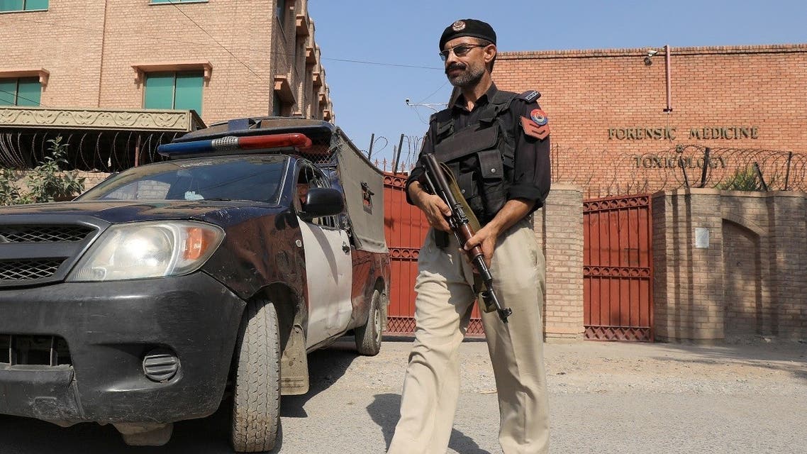 A police officer stands outside the Khyber Medical College (KMC) morgue in Peshawar, Pakistan July 29, 2020. (Reuters/Fayaz Aziz)