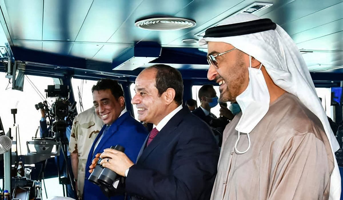 Egypt’s President Sisi (C), accompanied by Abu Dhabi Crown Prince Sheikh Mohammed bin Zayed (R), standing in a control tower during the inauguration of the naval base in Gargoub on July 3, 2021, in Egypt's northwestern Mediterranean coastal city of Masra Matruh. (Egyptian Presidency/AFP)
