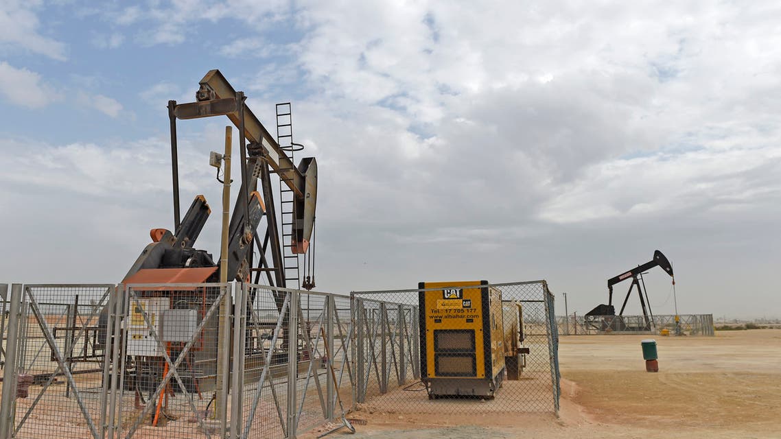 Pumpjacks operate in the desert oil fields of Sakhir in southern Bahrain on April 22, 2020. (AFP)