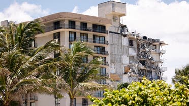 Search and Rescue teams look for possible survivors in the partially collapsed 12-story Champlain Towers South condo building on June 30, 2021 in Surfside, Florida. (AFP)