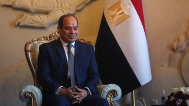 Egyptian President Abdel Fattah al-Sisi looks on as he is welcomed by his Iraqi counterpart (unseen) at Baghdad Airport in Iraq's capital on June 27, 2021.
