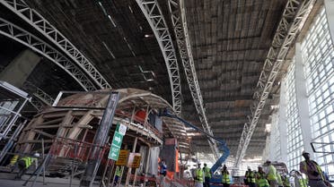 Visitors and journalists tour the construction site of the midfield terminal of Abu Dhabi International Airport in Abu Dhabi, UAE. (Reuters)