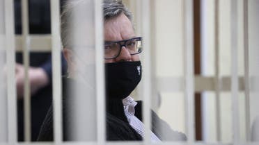 In this file photo taken on February 17, 2021 opposition politician and banker Viktor Babaryko, charged with corruption and money laundering, is seen from inside a defendants' cage during the opening day of his trial in Minsk. (File photo: AFP)
