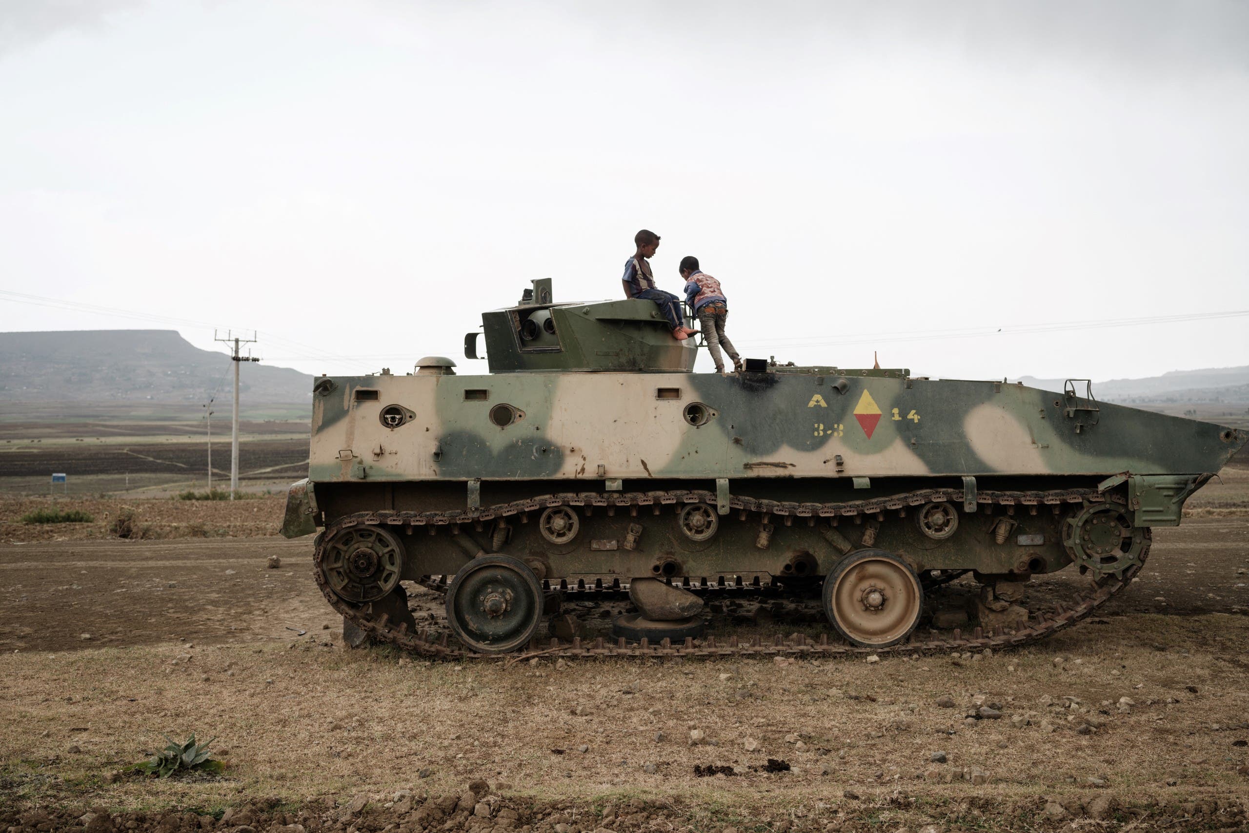 Children playing on a tank left by the Ethiopian army before withdrawing from some areas of the Tigray region