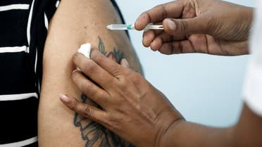 A healthcare worker receives an AstraZeneca's COVISHIELD vaccine, during the coronavirus disease (COVID-19) vaccination campaign, at a medical centre in Mumbai, India, January 16, 2021. (Reuters)