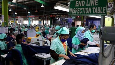  Garment employees work at Fakhruddin Textile Mills Limited in Gazipur, Bangladesh, on February 7, 2021. (Reuters)