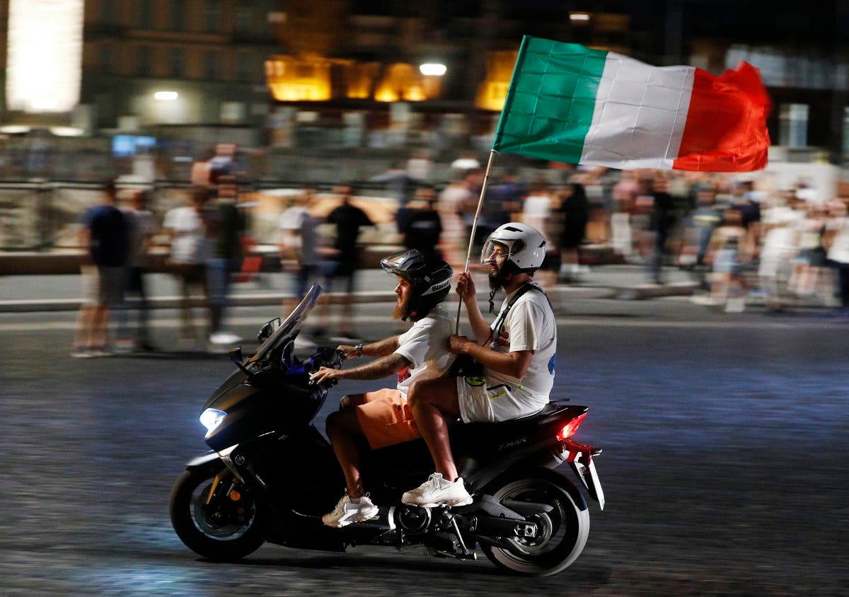  Italy fans celebrate after the match. (Reuters)
