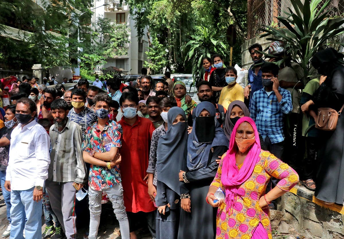 Fans gather near the residence of Bollywood actor Dilip Kumar after he died in a hospital in Mumbai, India, on July 7, 2021. (Reuters)