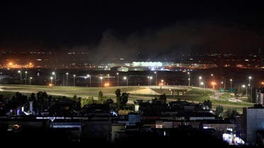 Smoke rises over the Erbil, after reports of mortar shells landing near Erbil airport, Iraq Feb. 15, 2021. (Reuters)