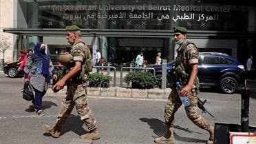 Two Lebanese soldiers walk as they secure the Medical Center at the American University of Beirut. (File photo:  Reuters)