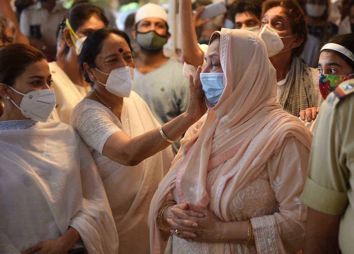 Saira Banu, wife of Bollywood actor Dilip Kumar, is consoled during the funeral of her husband in Mumbai, India, on July 7, 2021. (Reuters)