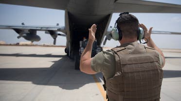 An Airman from the 746th Expeditionary Airlift Squadron guides a forklift off a C-130 Hercules at Udeid Air Base in Doha, Qatar, May 28, 2019. Picture taken May 28, 2019. Keifer Bowes/U.S. Navy/Handout via REUTERS ATTENTION EDITORS- THIS IMAGE HAS BEEN SUPPLIED BY A THIRD PARTY.