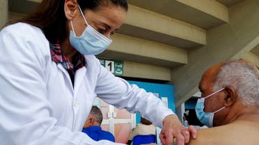 A man receives a coronavirus vaccine at a vaccination centre in Tunis, Tunisia. (Reuters)