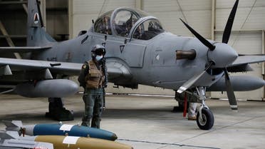 An Afghan pilot stands next to A-29 Super Tucano plane during a handover ceremony of A-29 Super Tucano planes from U.S. to the Afghan forces, in Kabul, Afghanistan, on September 17, 2020. (Reuters)