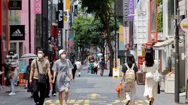 People wearing masks walk in a shopping district amid the coronavirus disease (COVID-19) pandemic in Seoul, South Korea, July 9, 2021. (Reuters)
