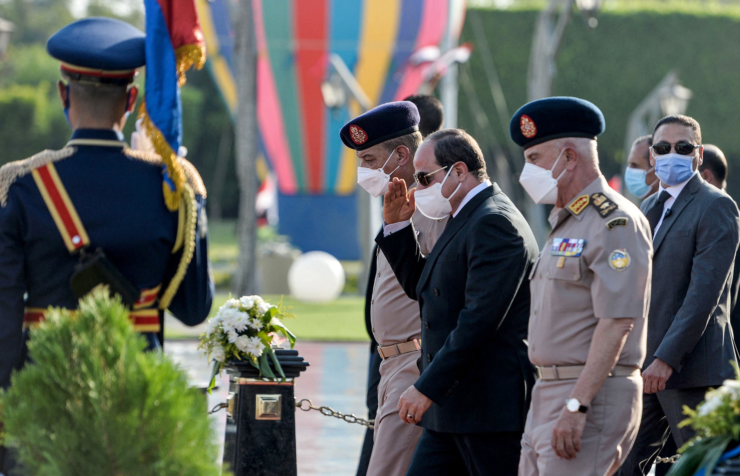 Egyptian President Abdel Fatah al-Sissi (C) attends the funeral of the widow of late president Anwar al-Sadat, Jihan al-Sadat, as she buried next to her husband at the unknown soldier memorial, in Cairo on July 9, 2021. (AFP)