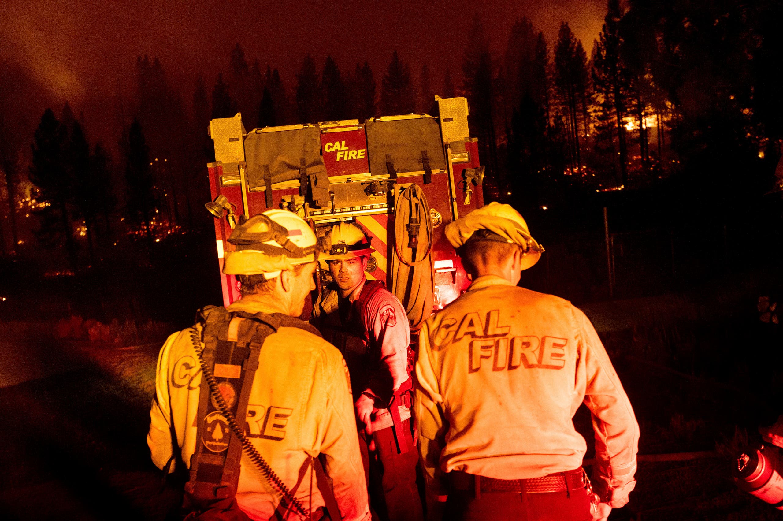 Firefighters work to stop the Sugar Fire, part of the Beckwourth Complex Fire, from spreading near Frenchman Lake in Plumas National Forest, California, on Thursday, July 8, 2021. (AP)