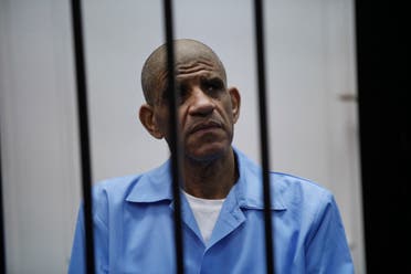 عبدالله السنوسي أثناء محاكمته في 2014 (رويترز)