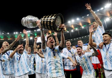 Argentina's Lionel Messi and teammates celebrate winning the Copa America with the trophy. (Reuters)
