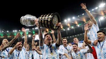 Argentina's Lionel Messi and teammates celebrate winning the Copa America with the trophy. (Reuters)