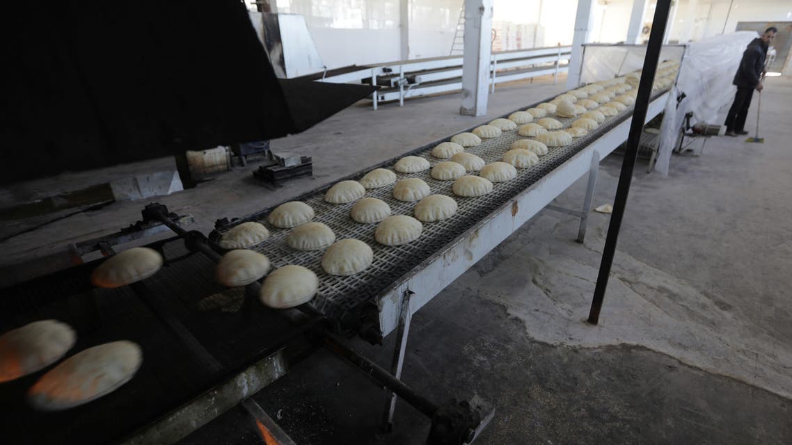 A man sweeps the floor near bread at a bakery in Azaz, Syria January 26, 2020. Picture taken January 26, 2020. (Reuters)