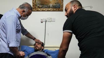 Iraq’s PM visits activist Ali al-Mikdam after he was kidnapped, assaulted