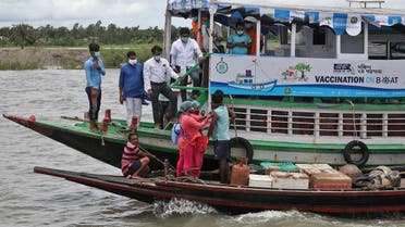Manobesh Mondol, a fisherman, receives a dose of COVISHIELD vaccine, a coronavirus vaccine manufactured by Serum Institute of India, during ‘Vaccination on boat’ program in Bali Island in the eastern state of West Bengal, India, on July 12, 2021. (Reuters)