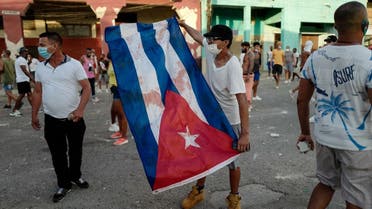 A man waves a Cuban flag during a demonstration against the government of Cuban President Miguel Diaz-Canel in Havana, on July 11, 2021. (Adalberto Roque/AFP)