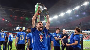 Italy's Domenico Berardi celebrate with the trophy after winning Euro 2020 with teammates. (Reuters)