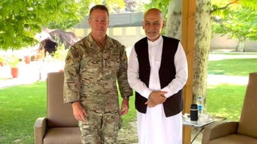 Afghanistan’s President Ashraf Ghani (R) meets General Austin Scott Miller, commander of US forces and NATO’s Resolute Support Mission in Kabul, Afghanistan, on July 2, 2021. (Reuters)