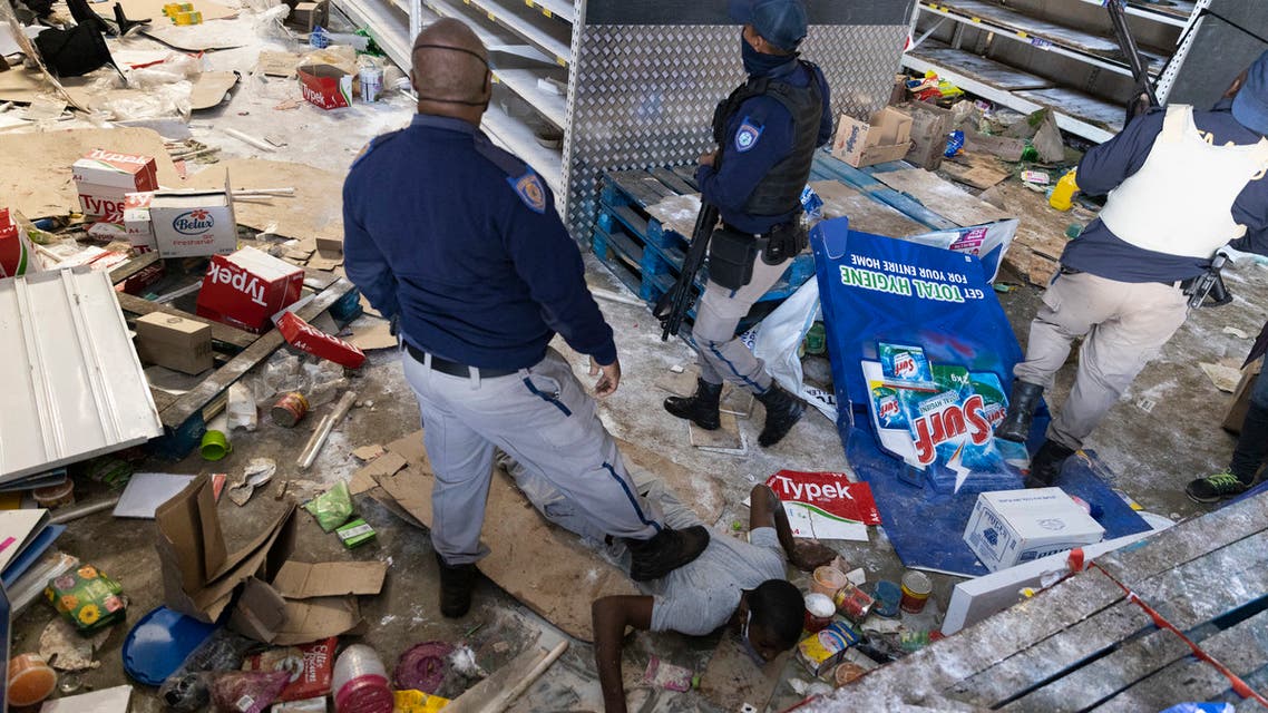 South African Police Services (SAPS) members arrest a looter at the Gold Spot Shopping Centre in Vosloorus, southeast of Johannesburg, on July 12, 2021. (File photo: AFP)