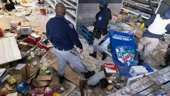 Looting, violence spreads in South Africa as grievances boil over