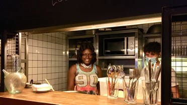 Chef Mariam Sesay prepares her dishes for her first customers. (Image: Robert McKelvey)