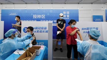 Residents receive vaccines against the coronavirus disease (COVID-19) at a makeshift vaccination site in Guangzhou, Guangdong province, China June 21, 2021. (Reuters)
