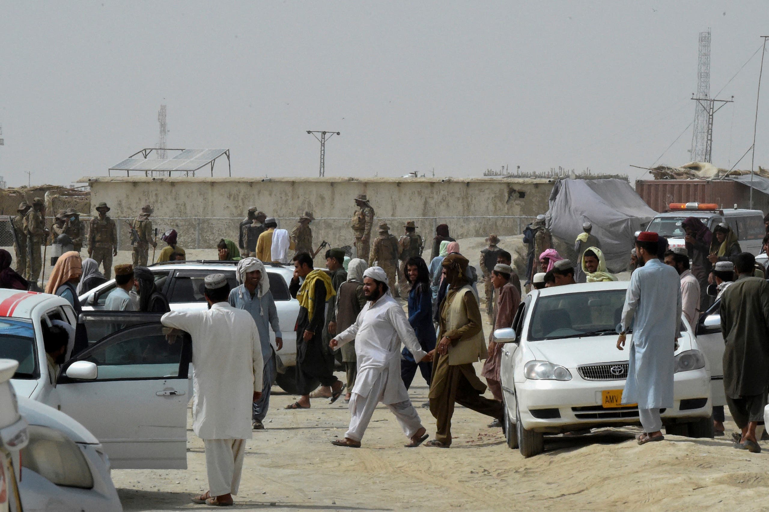 A gathering of stranded travelers in Pakistan after the Taliban took control of the crossing