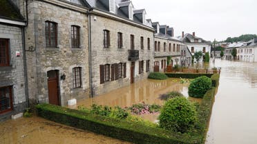 This picture shows a flooded street in Rochefort on July 15 2021 as disaster plan has been declared in Belgium's provinces of Liege, Luxembourg and Namur after heavy rains and floods lashing western Europe have killed at least two people in the country.