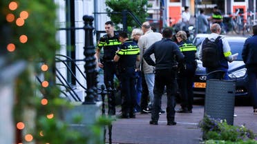 Police officers investigate the area where Dutch celebrity crime reporter Peter R. de Vries was reportedly shot and seriously injured, in Amsterdam, Netherlands, on July 6, 2021. (Reuters)