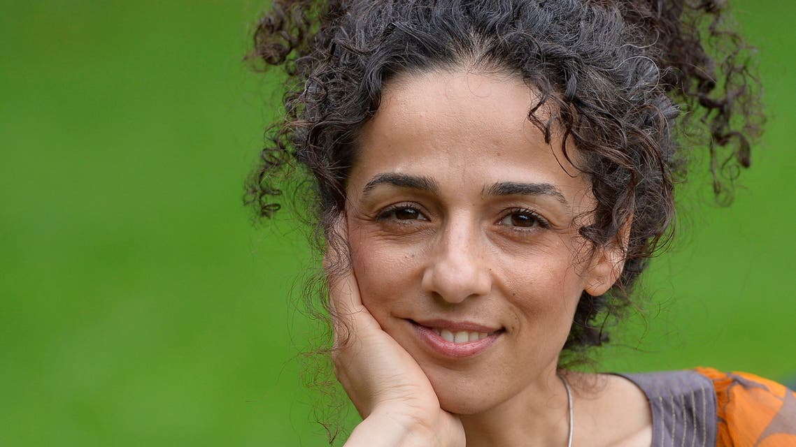 FILE PHOTO: Masih Alinejad, 37, Iranian journalist, poses for a portrait in London October 8, 2013. REUTERS/Toby Melville/File Photo