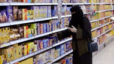 A Saudi woman wearing protective gloves shops at a supermarket in Riyadh, Saudi Arabia. (File photo: Reuters)