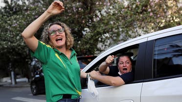 Supporters of Brazil's President Jair Bolsonaro shout in his support in front of Vila Nova Star Hospital, where the right-wing leader is being treated due to an obstructed intestine, in Sao Paulo, Brazil, on July 15, 2021. (Reuters)