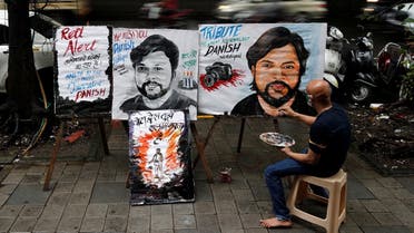 An artist applies finishing touches to a painting of Reuters journalist Danish Siddiqui, after he was killed, outside an art school in Mumbai, India, July 16, 2021. (Reuters)